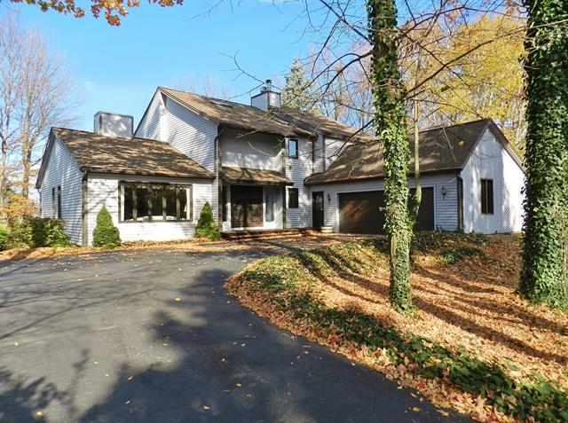 front view picture of 8717 Woodridge Drive, Williamsburg, MI. 49690