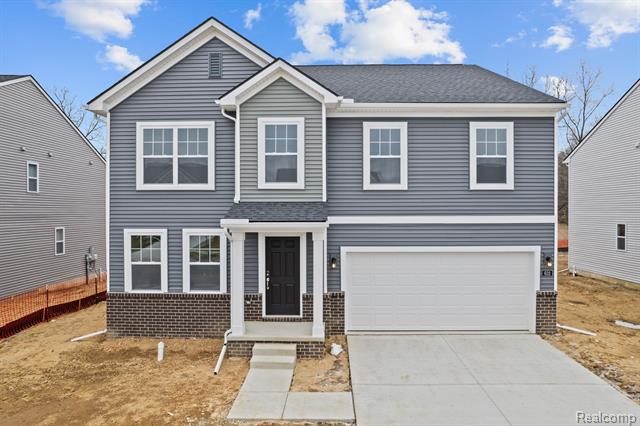 front view picture of 632 Countryside Drive, Chelsea, MI. 48118