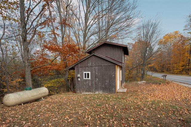front view picture of 4255 E Spencer Road, Kalkaska, MI. 49646