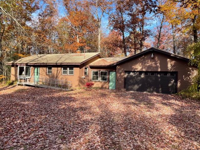 front view picture of 7468 W 6 1/2 Mile Road, Irons, MI. 49644