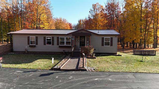 front view picture of 11935 W 16 Road, Mesick, MI. 49668