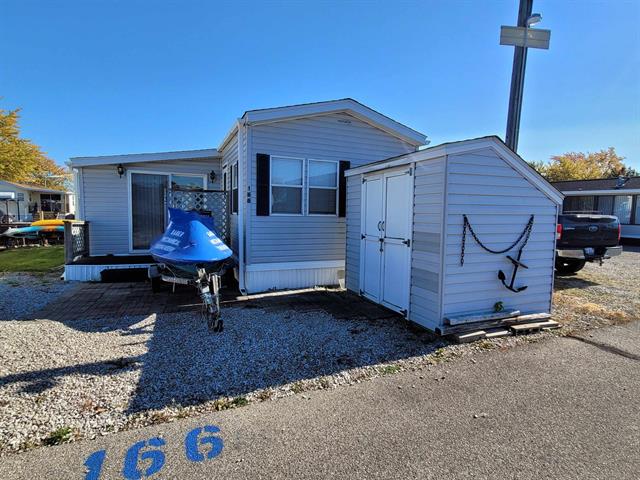 front view picture of 831 S Main St (Unit 166) Street, Au Gres, MI. 48703
