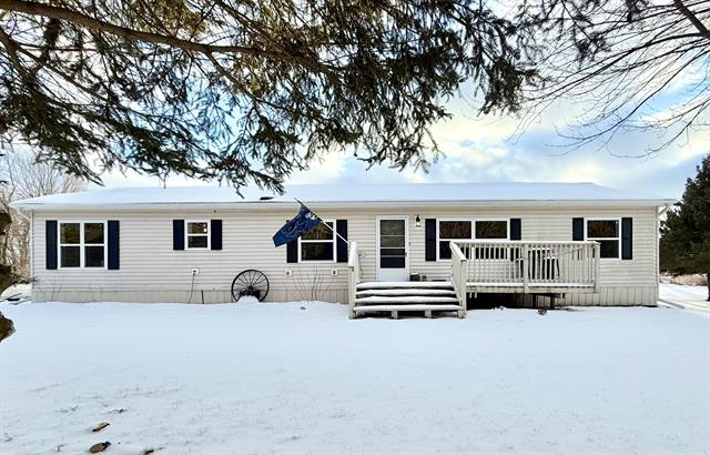 front view picture of 6343 W Almy Road, Six Lakes, MI. 48886