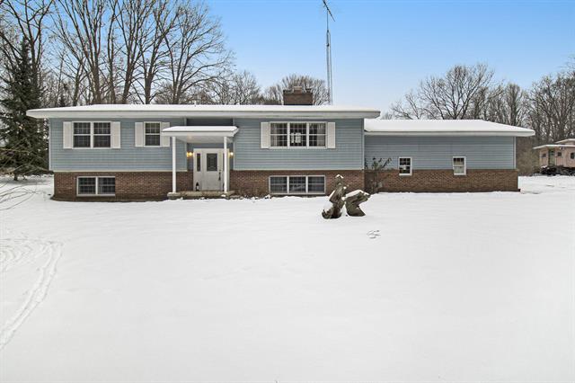 front view picture of 474 W County Line Road, Manistee, MI. 49660