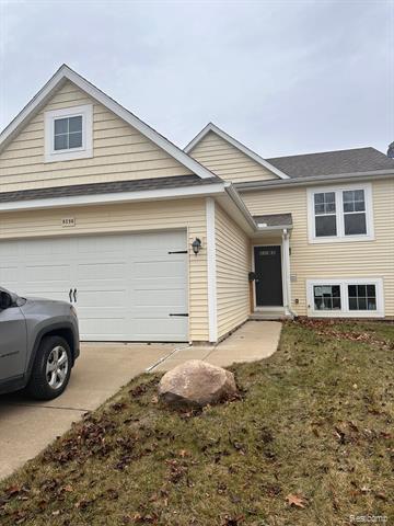front view picture of 8598 Pinnebog River Drive, Fowlerville, MI. 48836