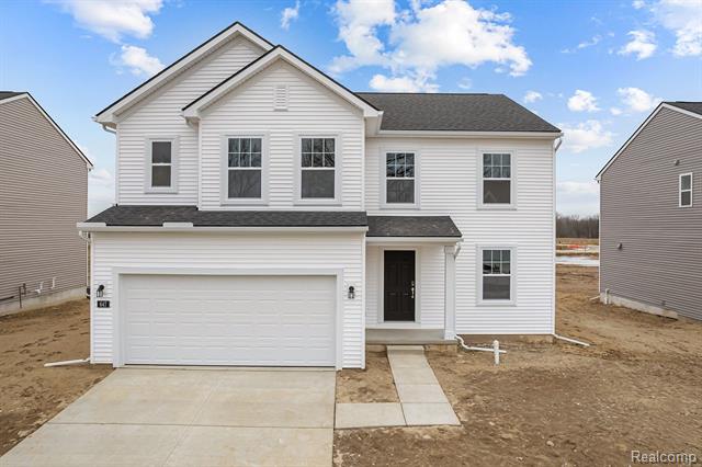 front view picture of 647 Countryside Drive, Chelsea, MI. 48118