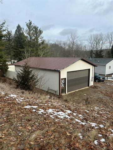 front view picture of 9309 Cox Drive, Reading, MI. 49274