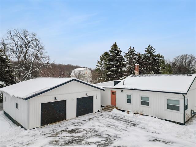 front view picture of 7638 Skegemog Point Road, Williamsburg, MI. 49690