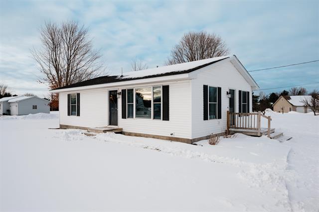 front view picture of 9557 Old M-72, Williamsburg, MI. 49690
