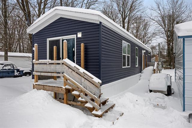 front view picture of 3423 N Circle Drive Ne, Kalkaska, MI. 49646
