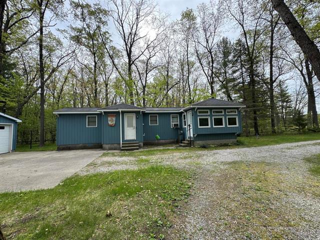 front view picture of 18570 Caberfae Highway, Wellston, MI. 49689