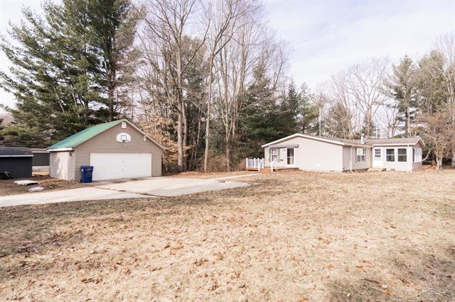 front view picture of 1073 Carmen Drive, Weidman, MI. 48893