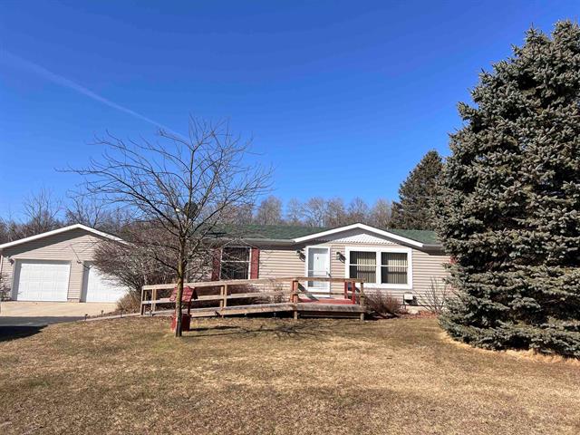 front view picture of 1051 Duquesa Drive, Weidman, MI. 48893