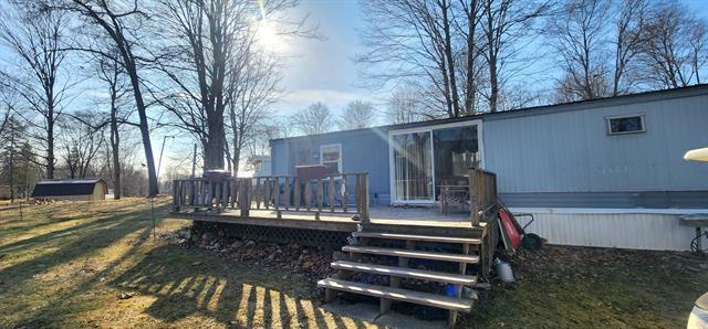 front view picture of 5395 Birch Island Drive, Barryton, MI. 49305