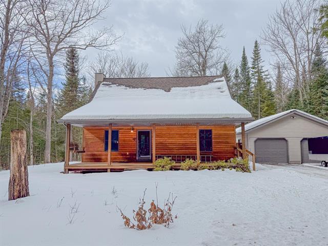 front view picture of 2124 S Roscommon Road, Prudenville, MI. 48651