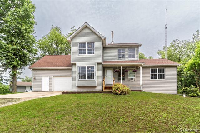 front view picture of 4898 Mount Morris Road, Columbiaville, MI. 48421