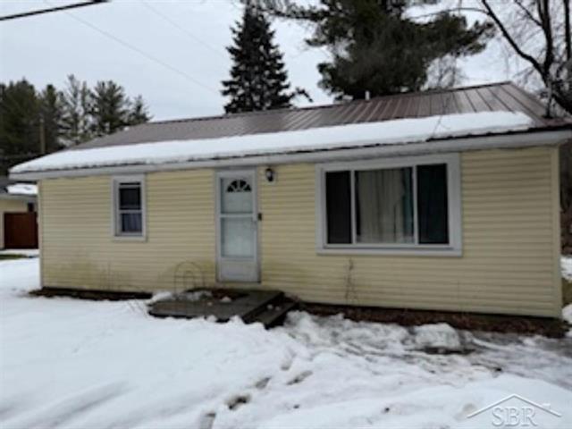 front view picture of 3136 N West River Road, Sanford, MI. 48657