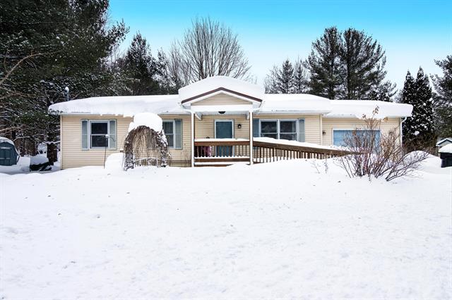 front view picture of 5639 Moore Road, Williamsburg, MI. 49690