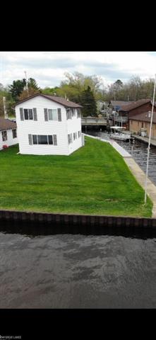 front view picture of 318 W Houghton Lake Dr Road, Prudenville, MI. 48651