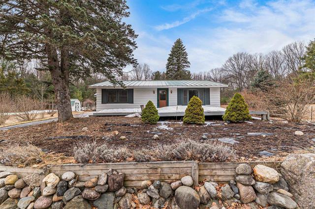 front view picture of 12060 S West Torch Lake Drive, Rapid City, MI. 49676