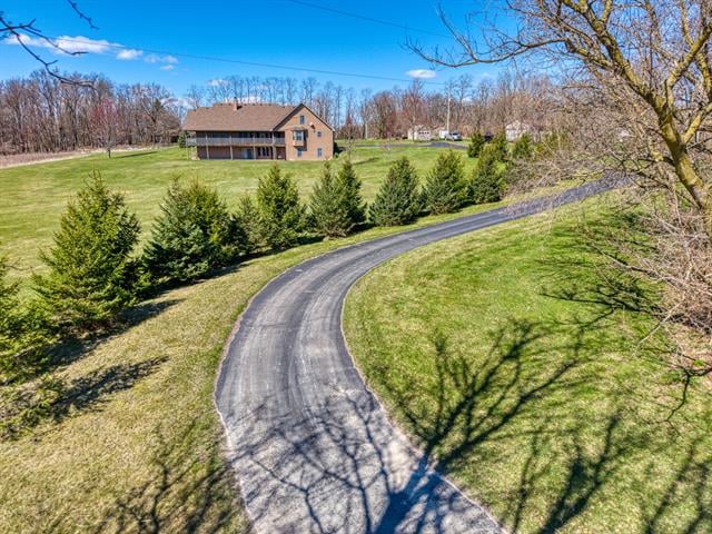 front view picture of 16590 Heim Road, Chelsea, MI. 48118