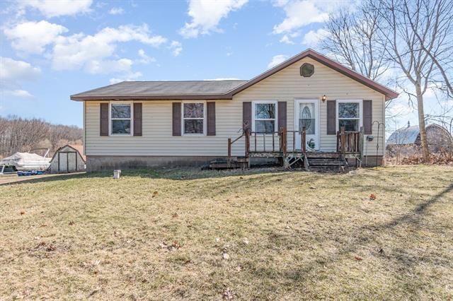 front view picture of 704 N Littlefield Road, Weidman, MI. 48893
