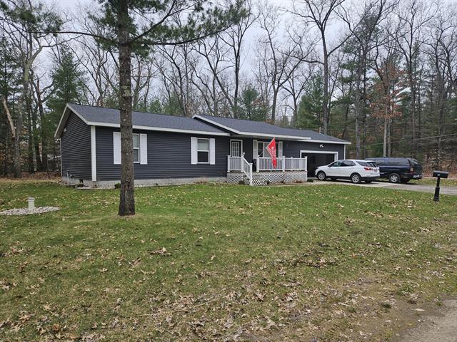 front view picture of 687 W Cherry Road, Twin Lake, MI. 49457