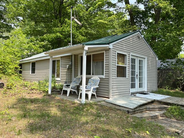 front view picture of 12715 Big Island Drive Ne, Gowen, MI. 49326