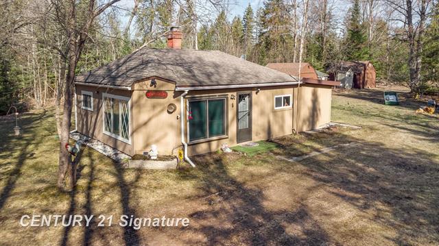 front view picture of 6002 Wildwood Drive, Alger, MI. 48610