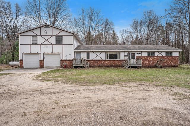 front view picture of 7693 Ellis Road, Ravenna, MI. 49451
