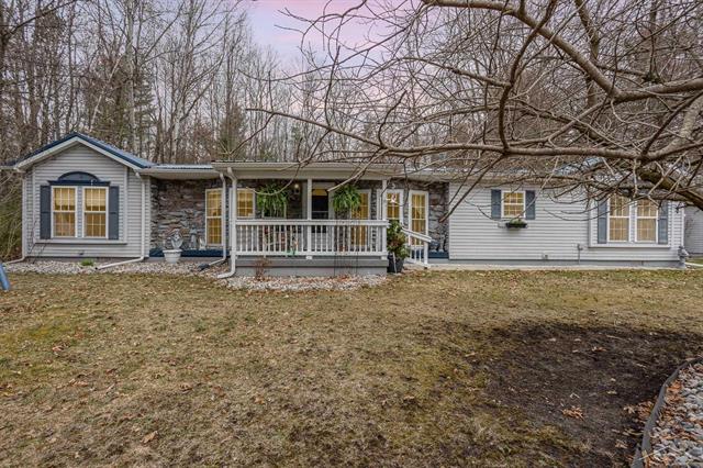 front view picture of 804 W Sand Beach Drive, Sanford, MI. 48657