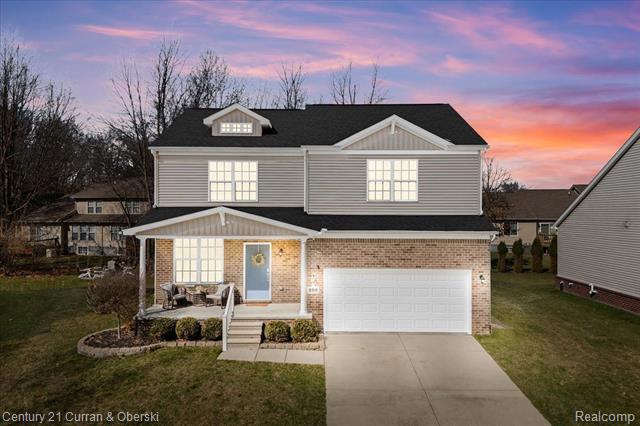 front view picture of 292 Wood Court, Howell, MI. 48843