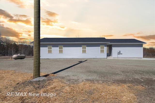 front view picture of 4056 Lang Road, Beaverton, MI. 48612
