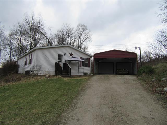 front view picture of 10682 Sunset Drive, Portland, MI. 48875