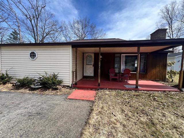 front view picture of 216 Devonshire Drive, Prudenville, MI. 48651