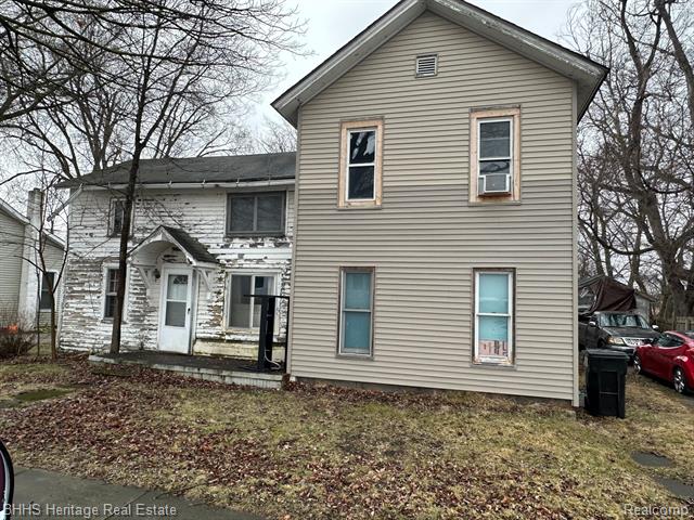 front view picture of 128 S Ann Street, Fowlerville, MI. 48836