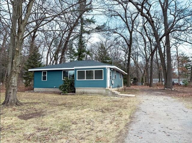 front view picture of 5860 East Street, Twin Lake, MI. 49457