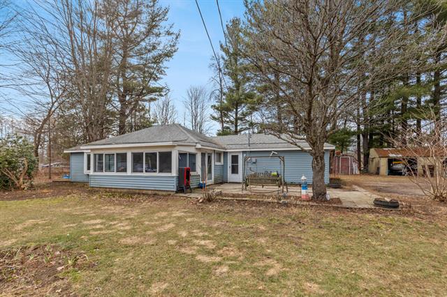 front view picture of 9881 N Six Lakes Road, Six Lakes, MI. 48886