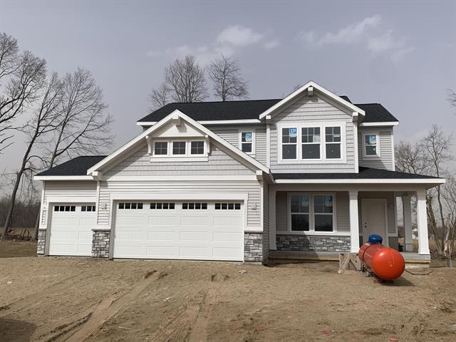 front view picture of 7861 Woodhurst Drive Ne, Rockford, MI. 49341