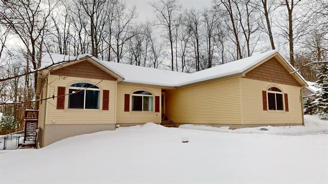 front view picture of 203 Winter Jasmine Lane, Roscommon, MI. 48653