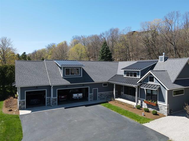 front view picture of 9248 Sw Bay Shore Drive, Traverse City, MI. 49684