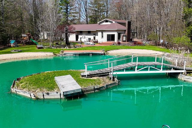 front view picture of 13045 Sw Coster Road, Fife Lake, MI. 49633