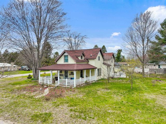 front view picture of 512 Kalkaska Road Nw, Kalkaska, MI. 49646