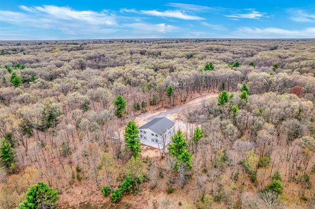 front view picture of 7050 Blue Lake Road, Twin Lake, MI. 49457
