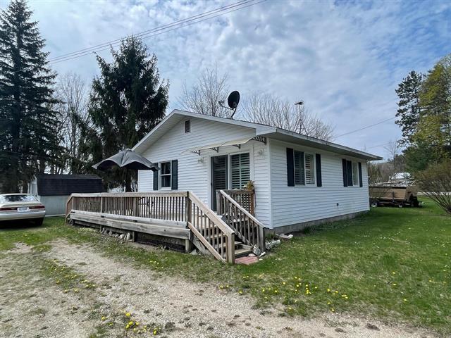 front view picture of 8117 North Street, Central Lake, MI. 49622