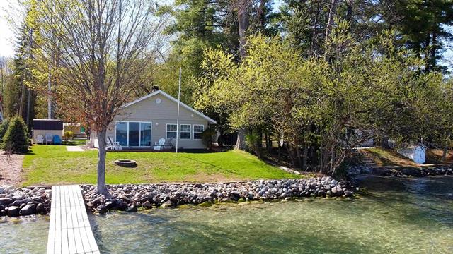 front view picture of 10701 Sw Torch Lake Drive, Rapid City, MI. 49676