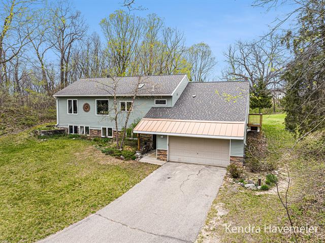 front view picture of 6011 4 Mile Road Ne, Ada, MI. 49301