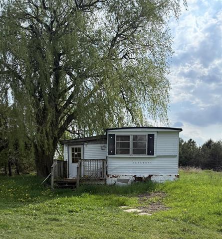 front view picture of 7957 30Th Avenue, Evart, MI. 49631
