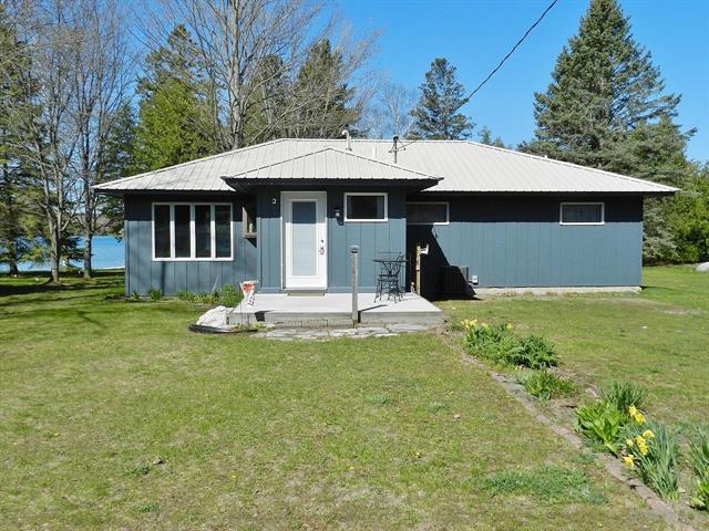 front view picture of 915 N Sunset Shores Drive, Lake Leelanau, MI. 49653