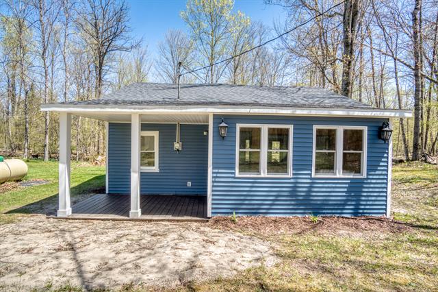 front view picture of 10058 Grindstone Road, Evart, MI. 49631